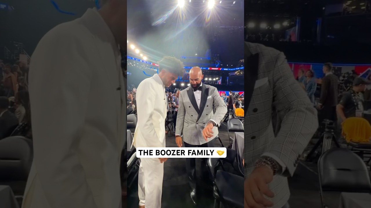 Cam Boozer daps up his twin brother and his Dad Carlos Boozer 🤝