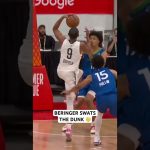 Beringer climbing the ladder to swat away the dunk attempt