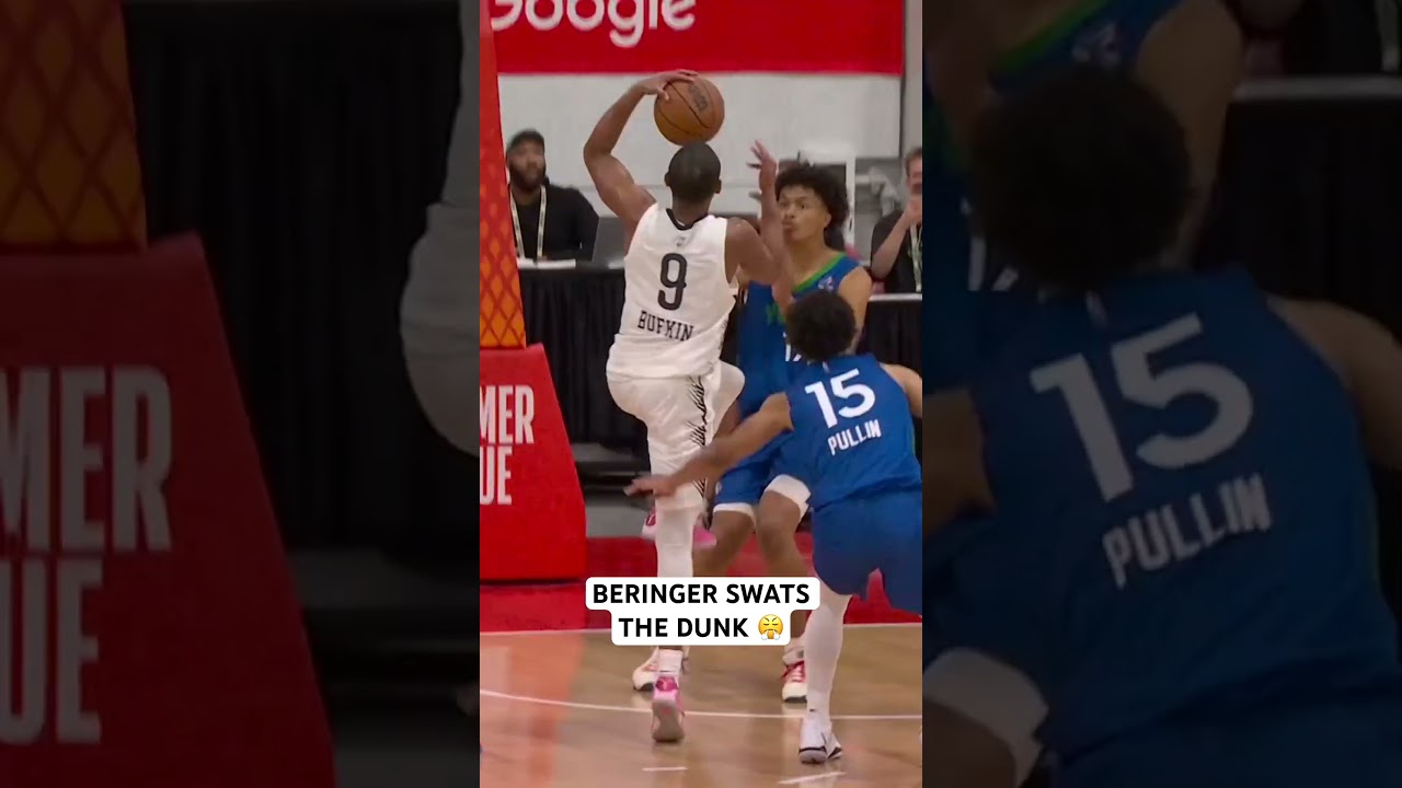 Beringer climbing the ladder to swat away the dunk attempt