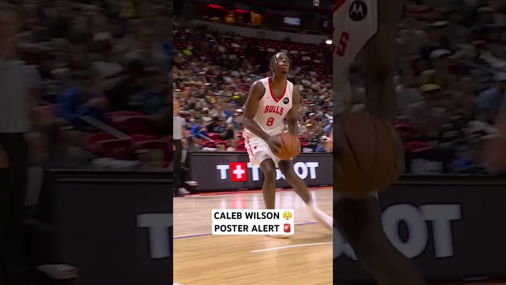 Caleb Wilson powers home the big two hand jam over the defender
