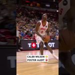 Caleb Wilson powers home the big two hand jam over the defender